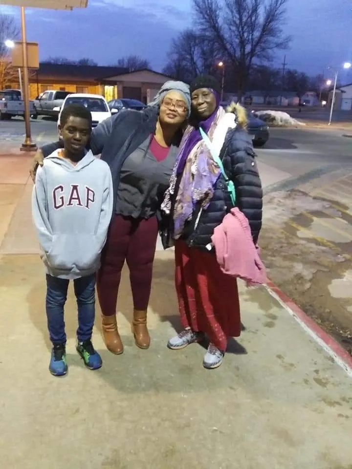 Khadija with family on a street in Grand Island