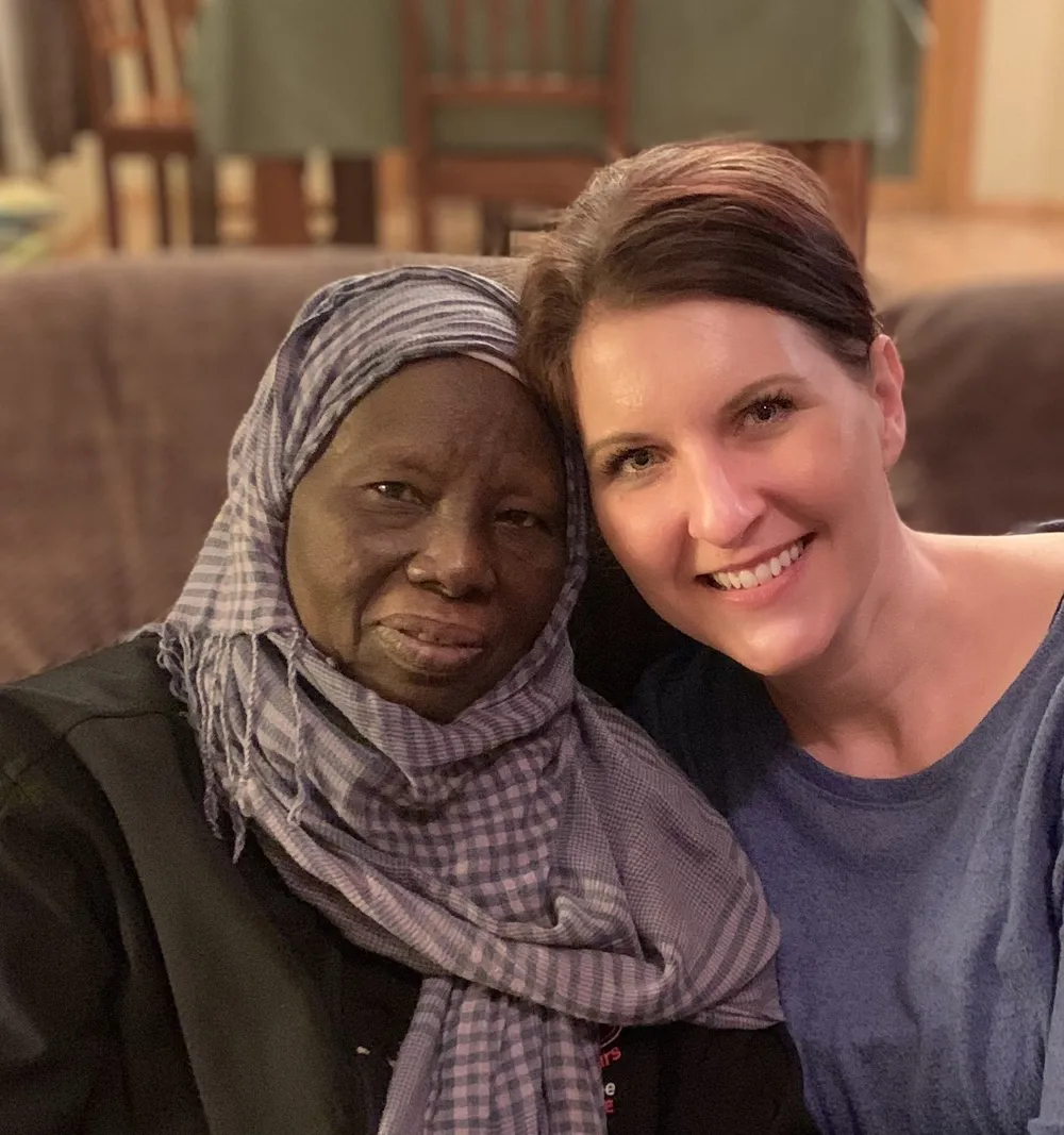 Khadija Hussein Abdudaim smiling beside a friend